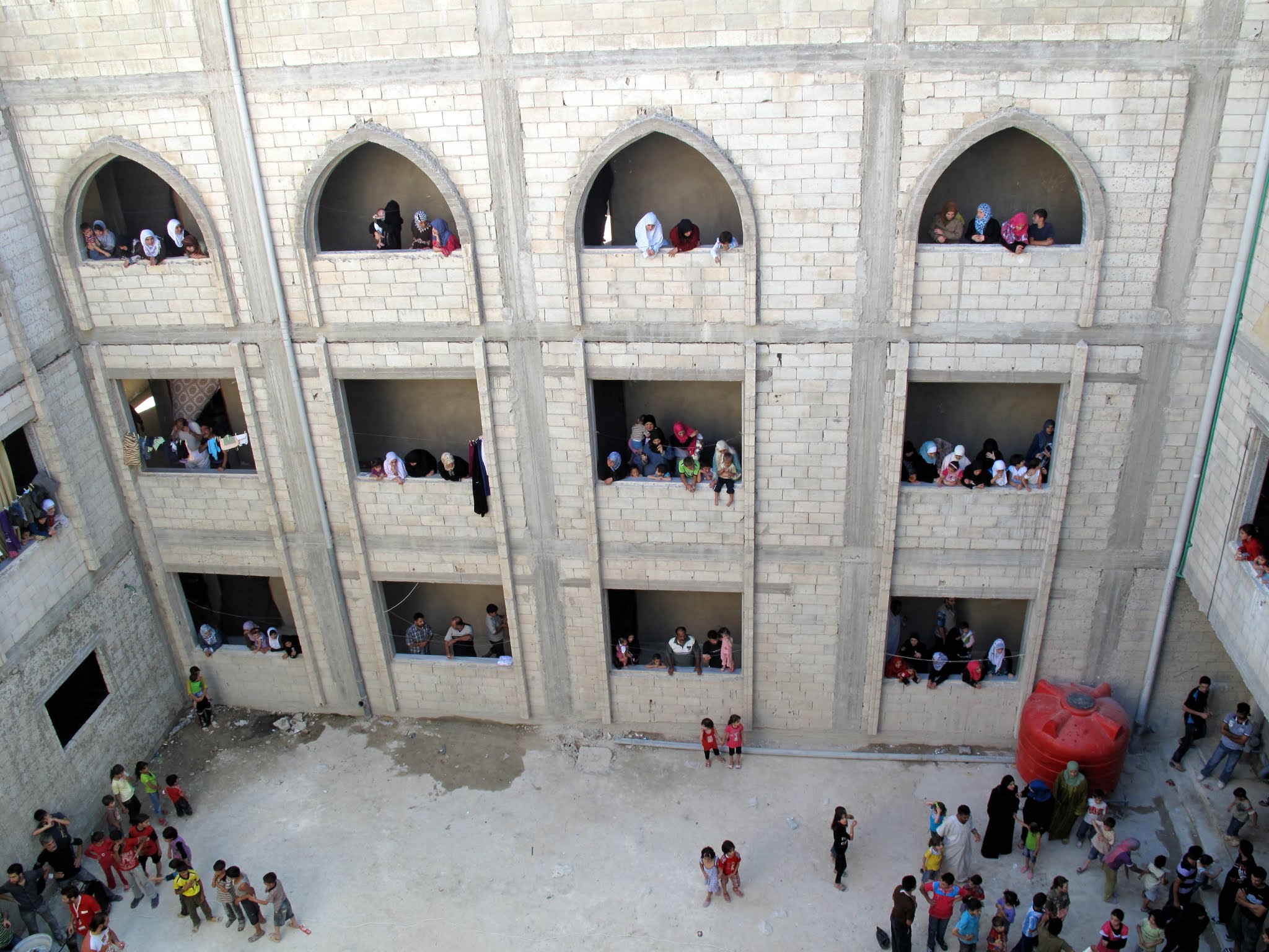 People displaced by the Syrian conflict are housed in schools and public buildings, like training institute, still under construction in Homs.
