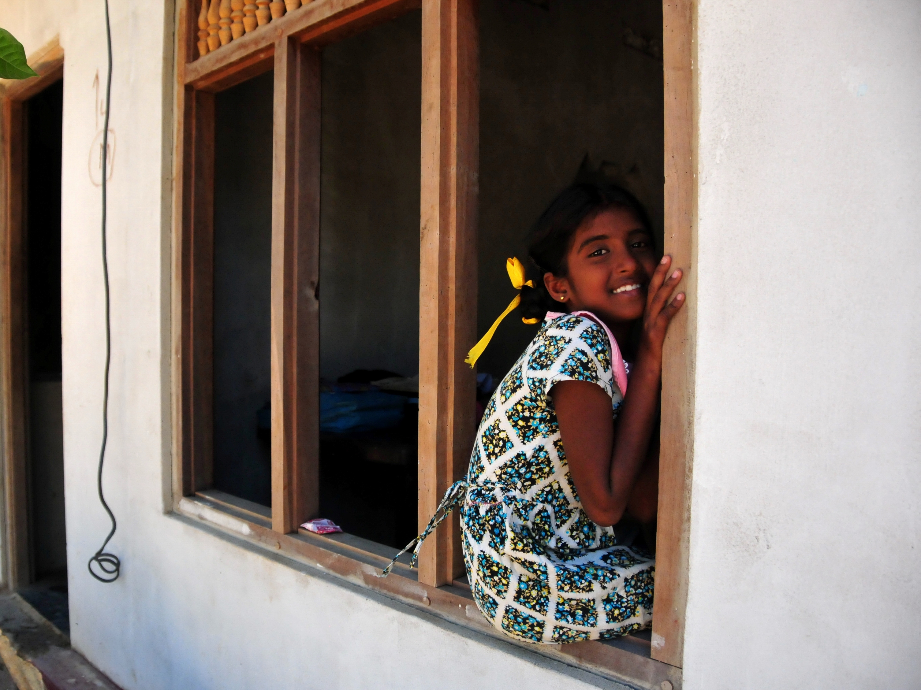 Genzia Mary a 10 yr old war returnee is desperate to make friends with the bus loads of tourists who visit the Vann