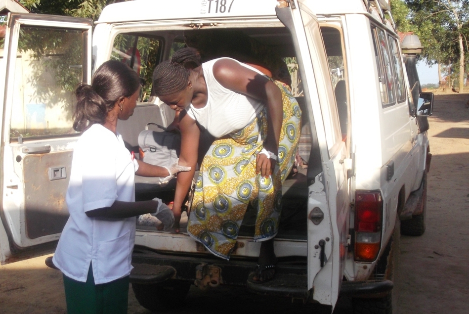 Mariama Bassah (30) is assisted out of the MSF ambulance to arrive at MSF Gondama Emeregency Health center just outside of Bo. She ended up having a caesarian section to deliver her baby. "I thank God Almighty for such a service ... now many pregnant wom