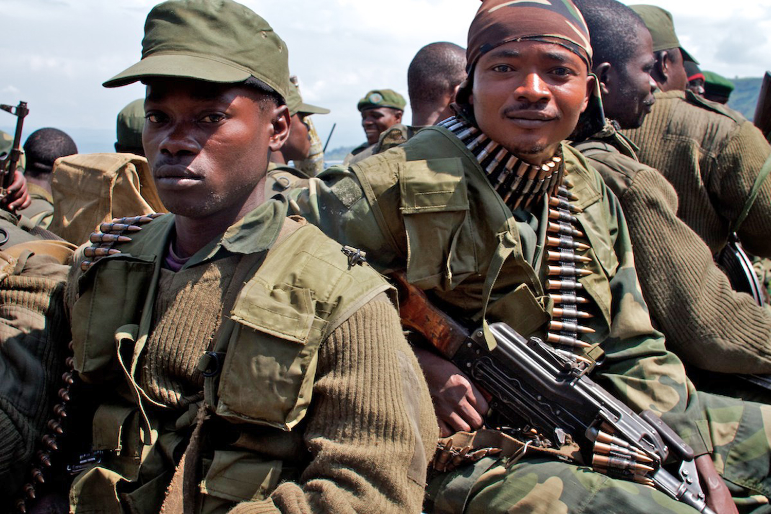 Government army (FARDC) troops in Minova, Democratic Republic of Congo, move to positions in the hills around the town