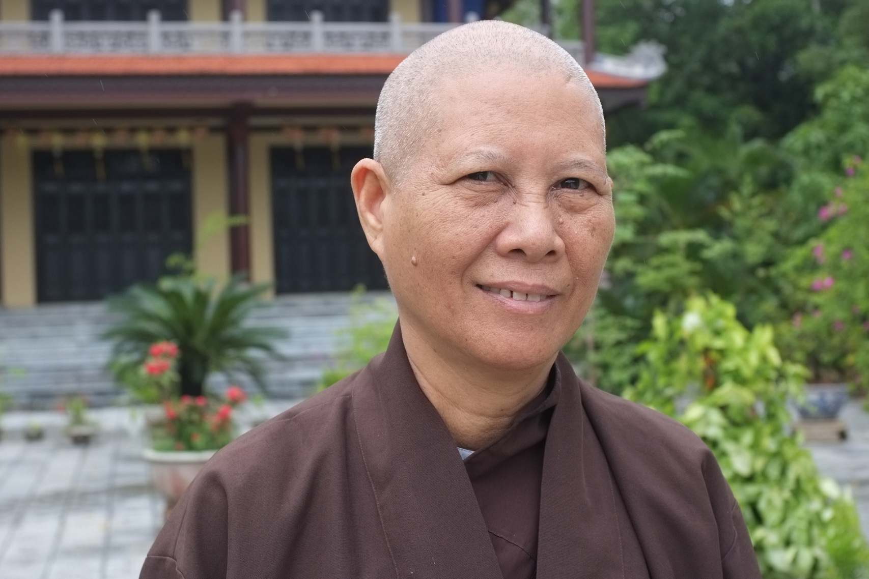 Buddhist nun, Sister True Compassion, outside Tay Linh temple in Hue, Vietnam. Buddhist temples have played a significant, though understudied, role in disaster response