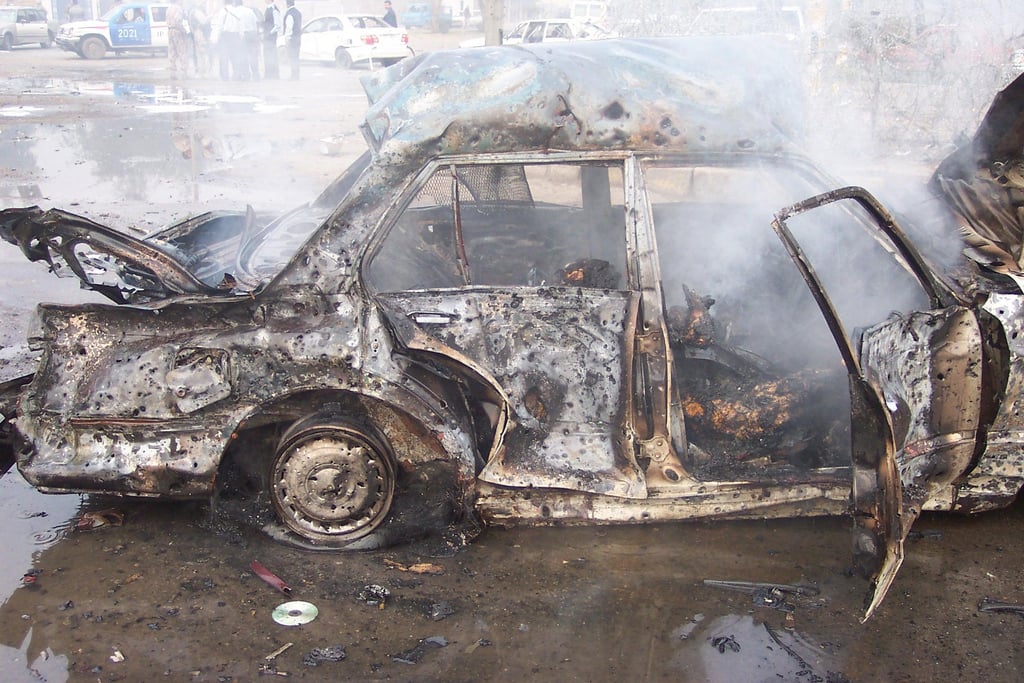 Charred body parts are among the remains of a massive suicide car bombing in the Iraqi capital Baghdad in December 2007