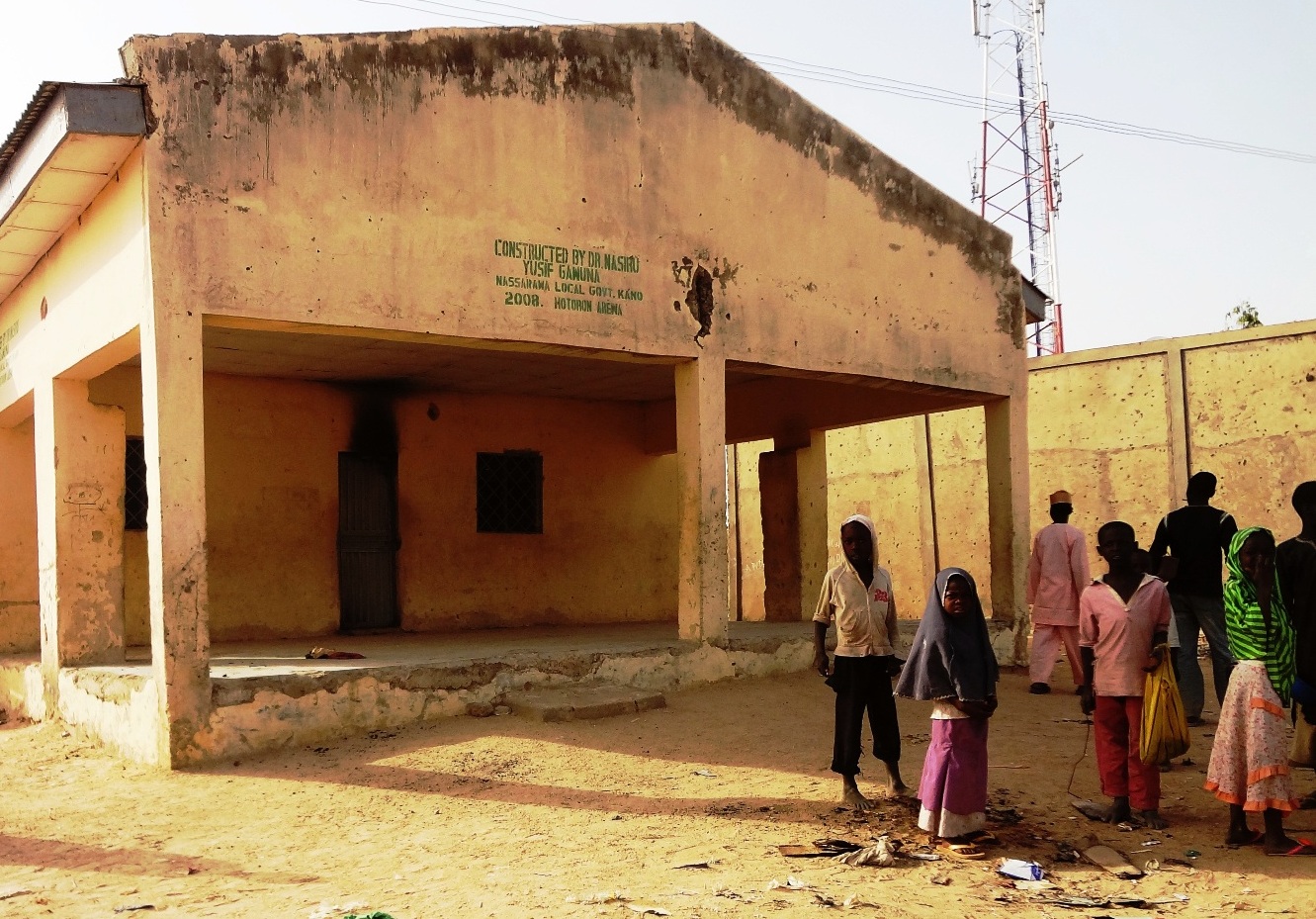 Children loiter outside the Haye clinic in Kano where seven polio vaccinators were killed on February 8, 2013