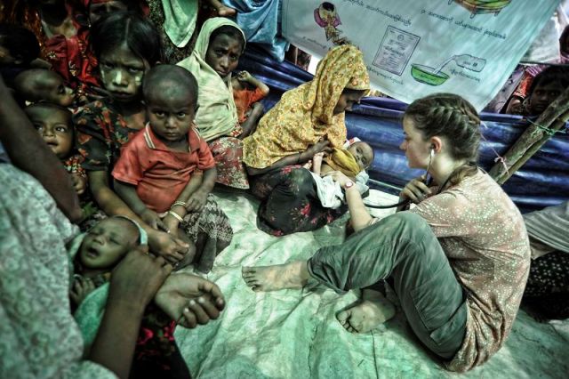 A doctor from an MSF medical team examines a child with diarrhoea at MSF clinic in a refugee camp on the outskirts of Pauk taw Township on 3 February, 2013. On that day, more than 80 diarrhoea cases were treated by MSF medical team