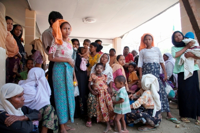 Hundreds of Rohingya IDPs in Rakhine State wait outside this makeshift clinic outside Sittwe, which has only a dozen cots and limited stores of medicines. Health workers predict rising cases of sickness and disease with the onset of the monsoon season.