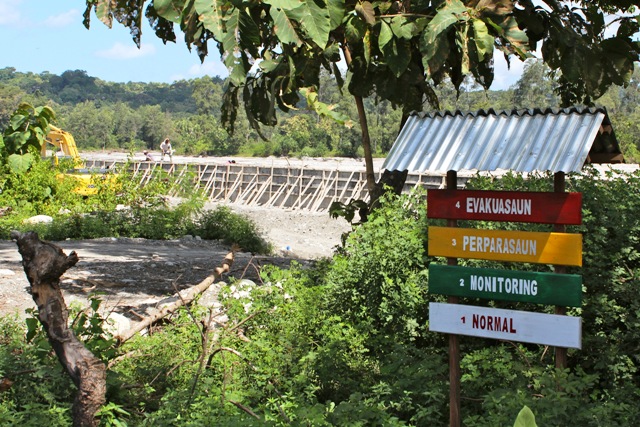 An early warning sign for flood evacuation (Save the Children DRR project), Sesurai, Manufahi District. Flooding is a major problem in Timor-Leste