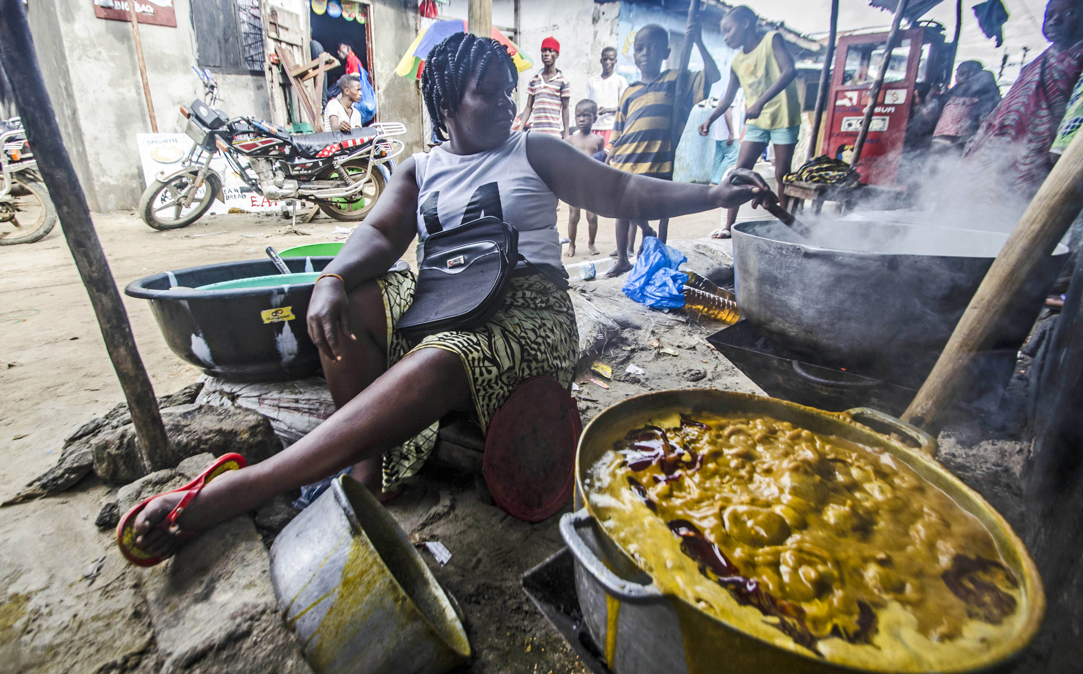 A food vendor makes soup in West Point, Liberia (June 2013)