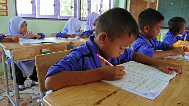 Grade 2 students study at the Ban Yanyong school in Naratiwat Province in Thailand's deep south. The ongoing insurgency has taken its toll on education in the area