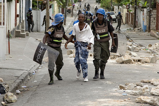 MINUSTAH Police Officers Detain University Student Protesters. 12/Jun/2009. Port au Prince, Haiti