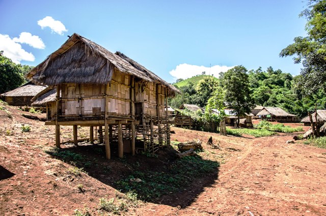 Village food storage sheds, made of bamboo and thatch, are traditionally built on stilts to withstand flooding. Monk Khmu village, northern Luang Prabang Province