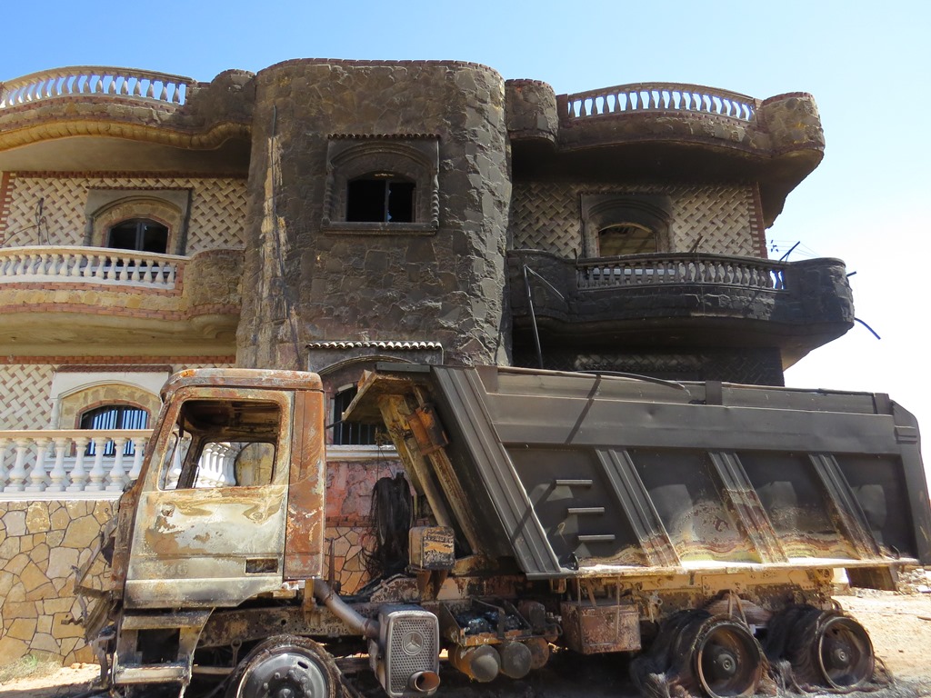 The home of an affluent Bedouin family in al-Mehdiya village, North Sinai. According to the family, the Egyptian army torched the home, several vehicles, a tractor and a generator on the basis that the family was involved in terrorist or smuggling operati