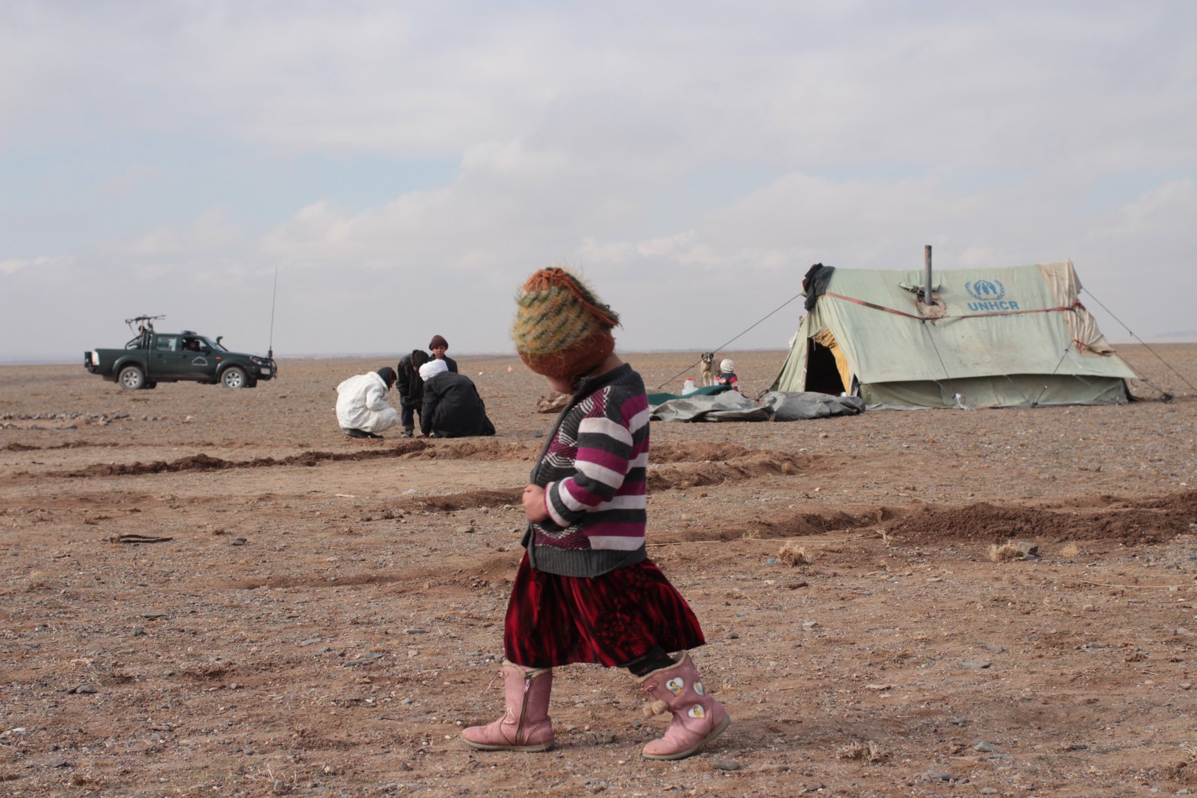 A displaced family near Herat set-up camp at a new IDP site after fleeing drought and insecurity in central Afghanistan (Jan 2014).