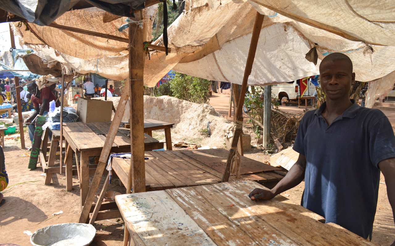 Butcher stall in Bangui, Central African Republic. Edgar, outside Eglise des Freres Castor, showing his empty butcher stall. Meat is hard to find in Bangui, as herders have fled to the bush.