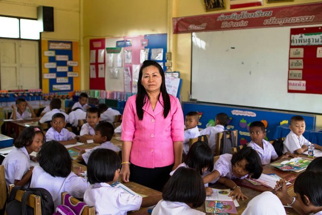 A teacher in Thailand's deep south looks to the camera. Many women have been affected by the decade-long conflict and are in need of additional social services