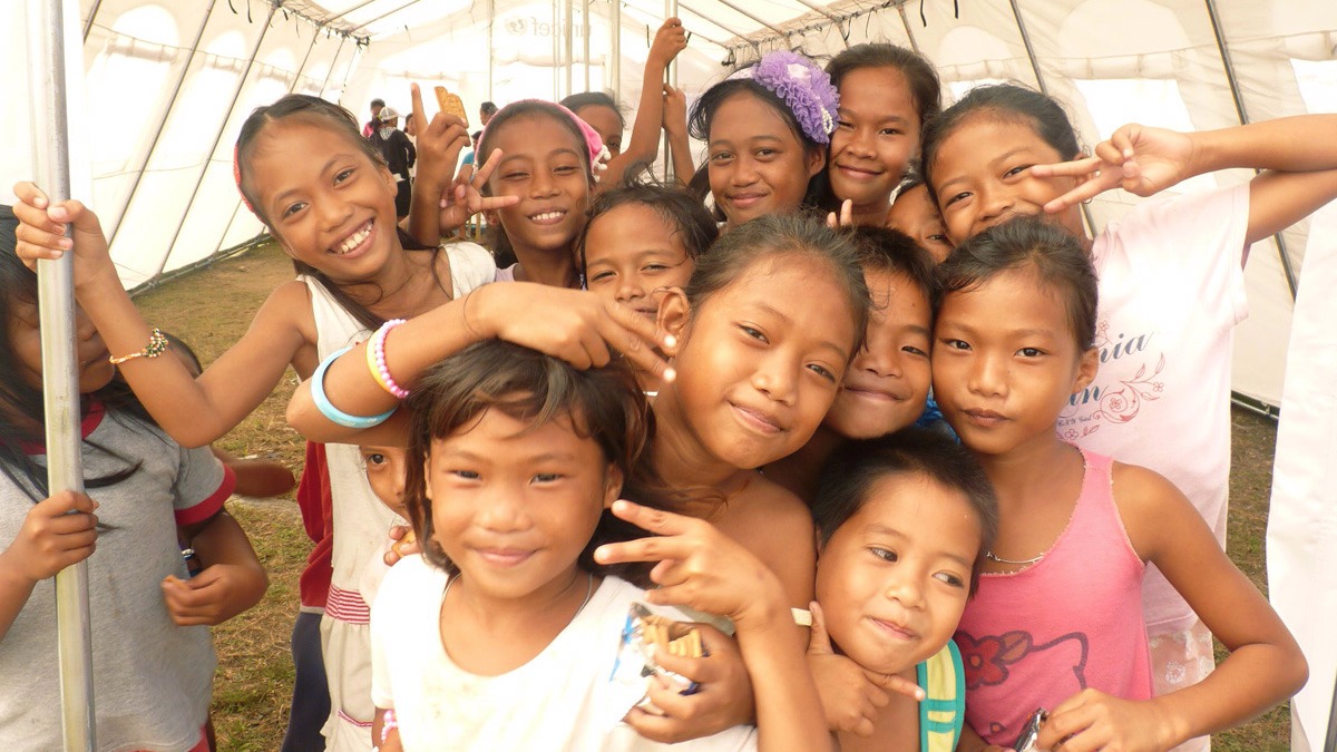 Children inside a temporary learning space in the aftermath of Typhoon Haiyan