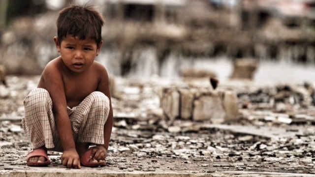 A child at an en evacuation center in Zamboanga city, one year after a deadly Muslim rebel siege