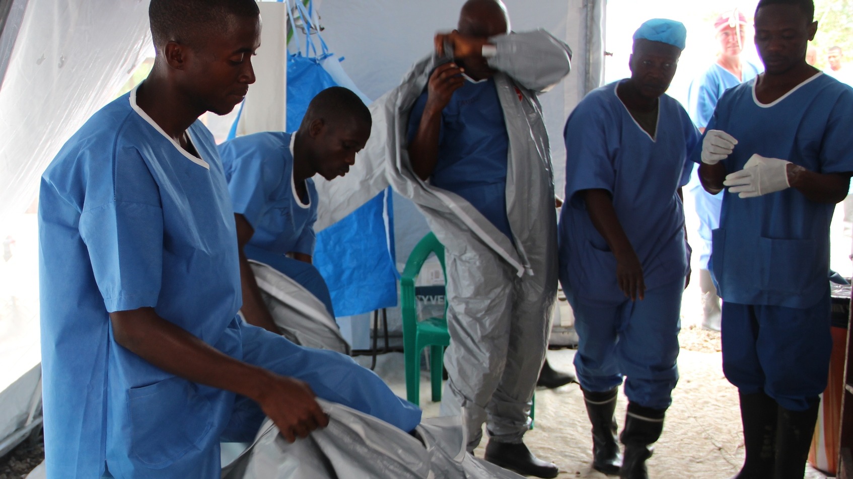 Health workers at the IFRC's Ebola treatment centre in Kenema are trained to put on their PPEs. The process takes 20 minutes.
