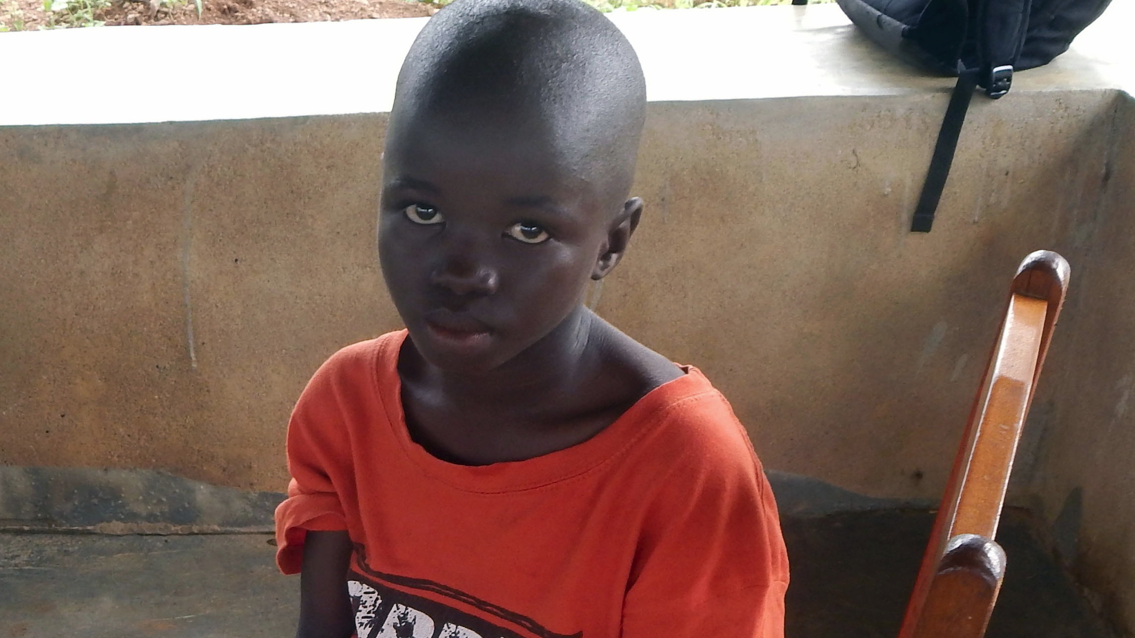 Lamin Borbor, 8, will live at the Interim Care Center for Ebola orphans in Kailahun town until social workers can reunite him with extended family or place him in foster care.