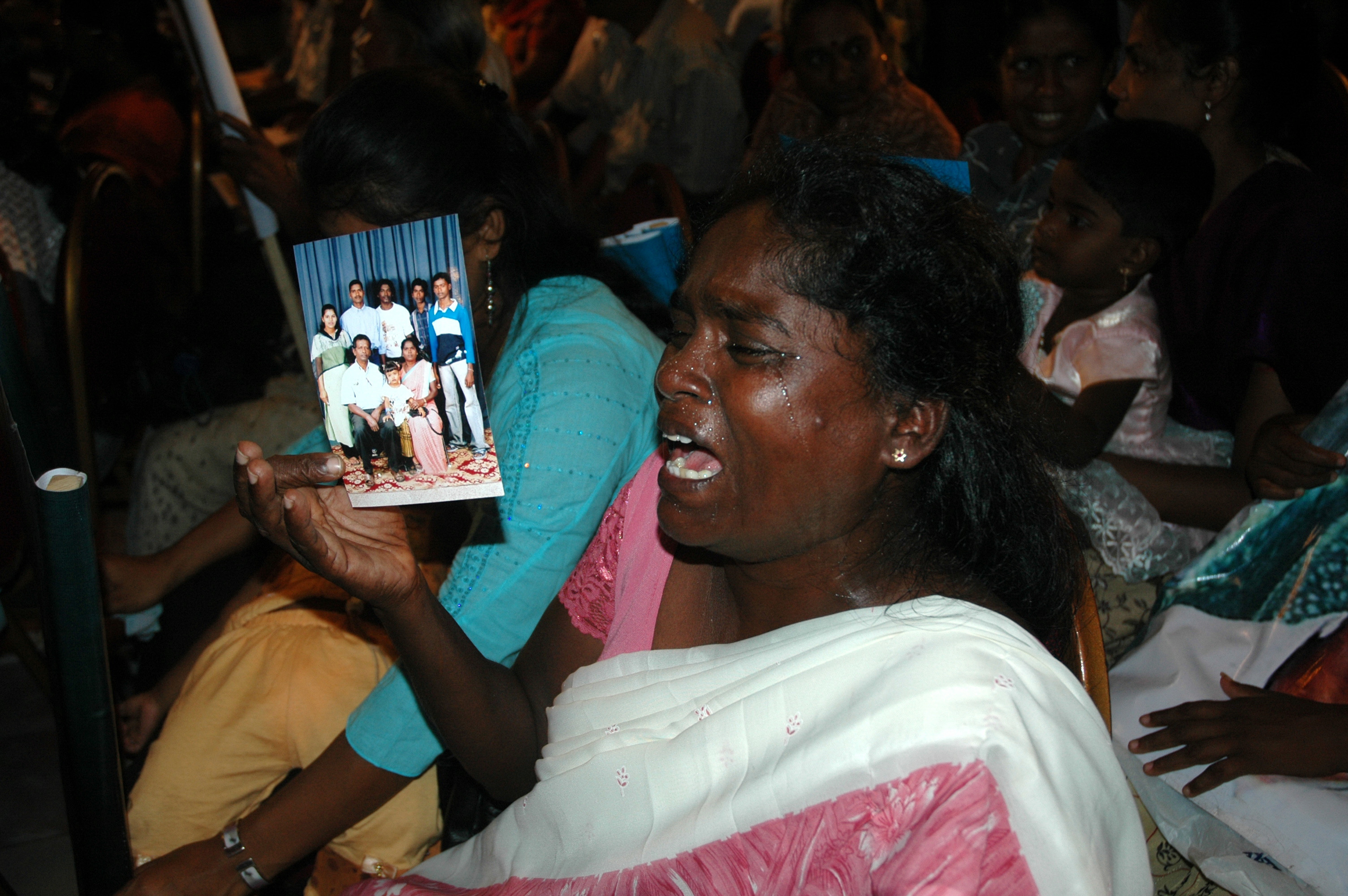 Family members of missing persons react during a meeting in the capital Colombo. There could be anywhere between 16,000 to 40,000 missing during the two and half decade war that ended in May 2009.