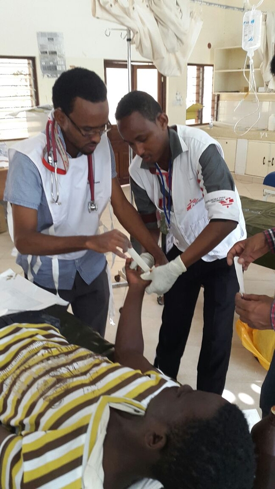 Doctors in a hospital in the Yemeni city of Aden tend to one of those injured in recent clashes