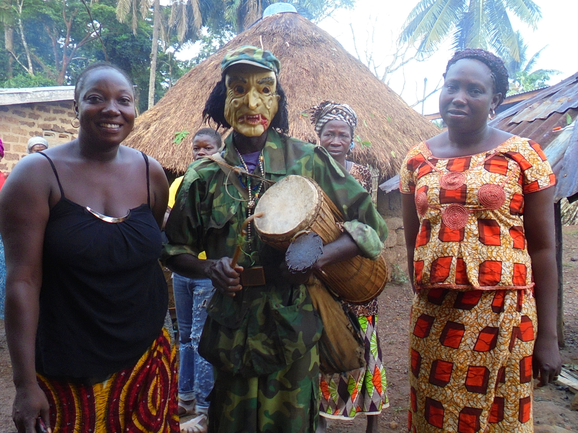 Drummers and dancers often come dressed in costume or masks as part of traditonal funeral rites in Guinea. Tamba Lamine Ouendeno was buried in April 2015, more than a year after his death from Ebola due to the clash between government restrictions on publ