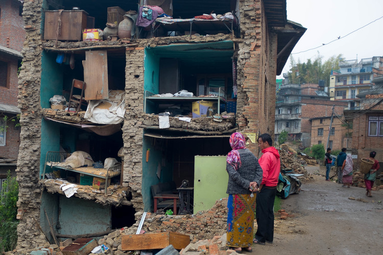 Residents of Bungamati, just outside the Nepali capital Kathmandu, stare at their old homes after a devastating earthquake