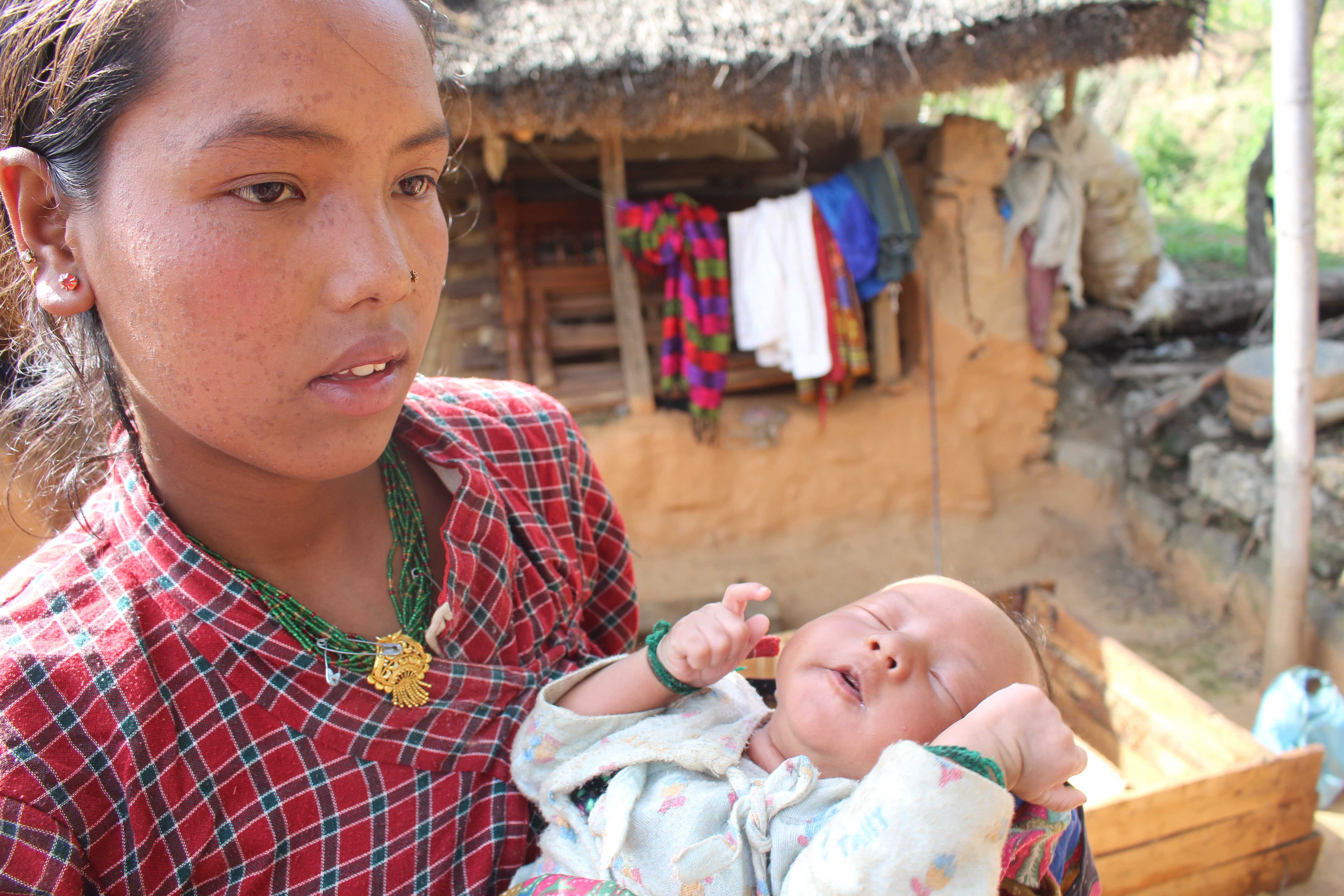 Nirmala Tamang and her 3-week old son, at Ghumarchowk village, 20 km from Kathmandu. Her family lost their home and livestock in the earthquake that struck Nepal 25 April