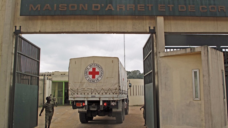 An International Red Cross and Red Crescent Society truck enters the Holding and Corrections Prison of Abidjan (MACA).