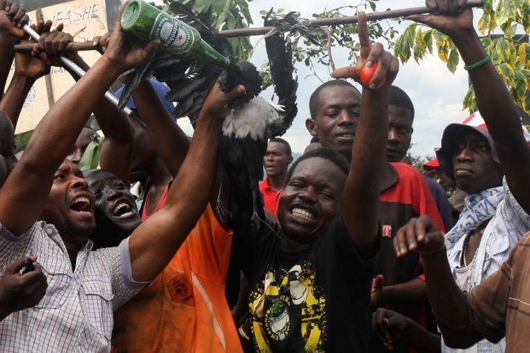Protestors in the Bujumbura neighbourhood of Musaga pretend to feed beer to a dead bird that is intended to represent, and to denigrate, Burundi’s ruling party, whose symbol is an eagle.