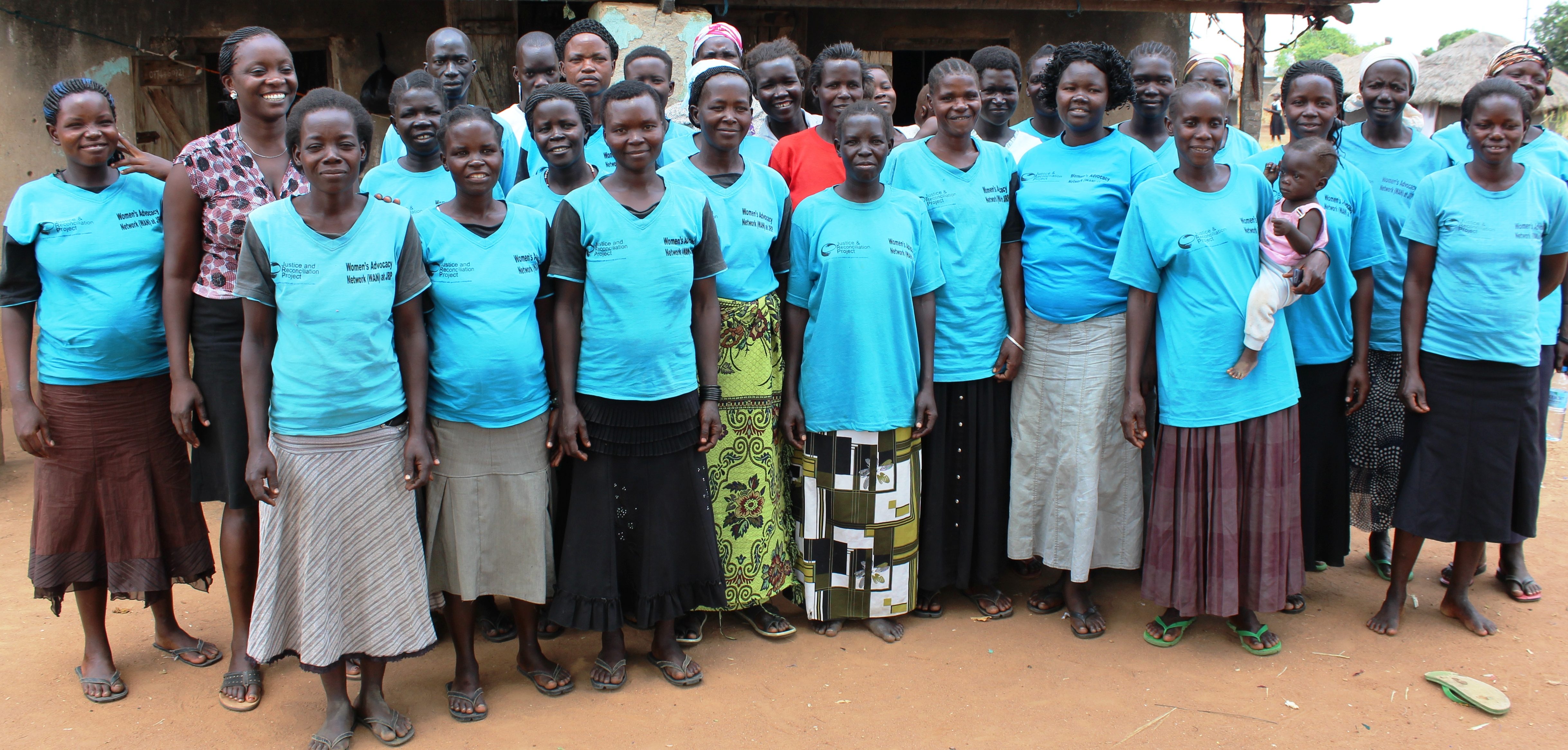 Some of the conflict-affected women including mothers of children born of war pose for a picture in Awach, Gulu district during JRP study.