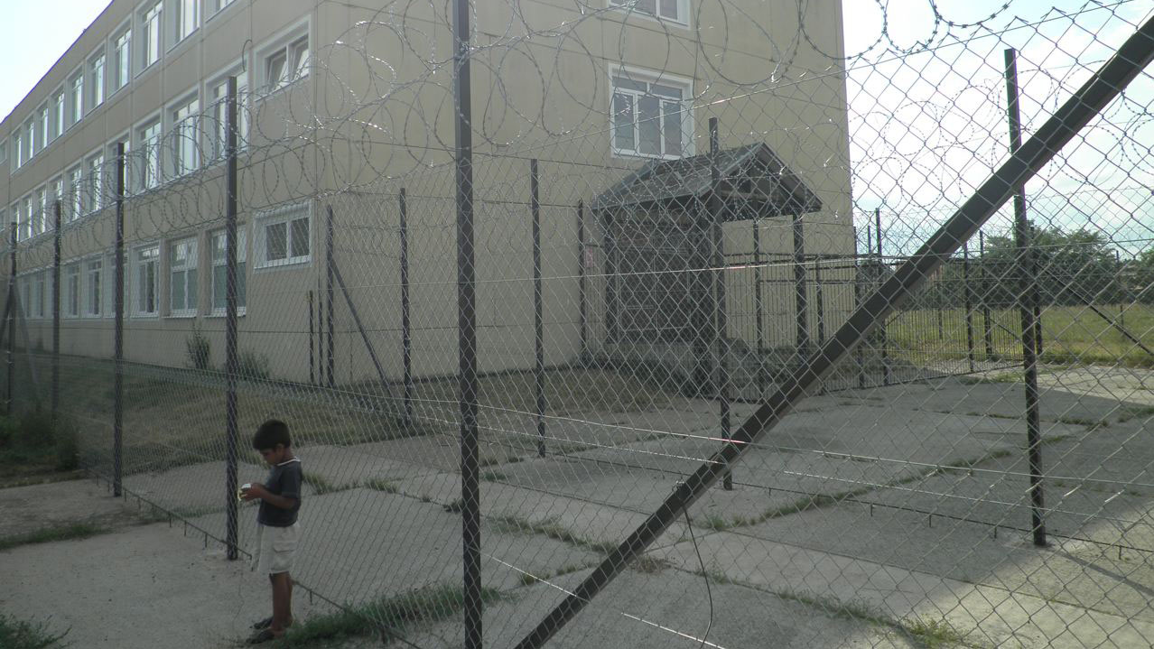 Razor wire surrounds Debrecen centre for asylum seekers in eastern Hungary. Parts of the centre are