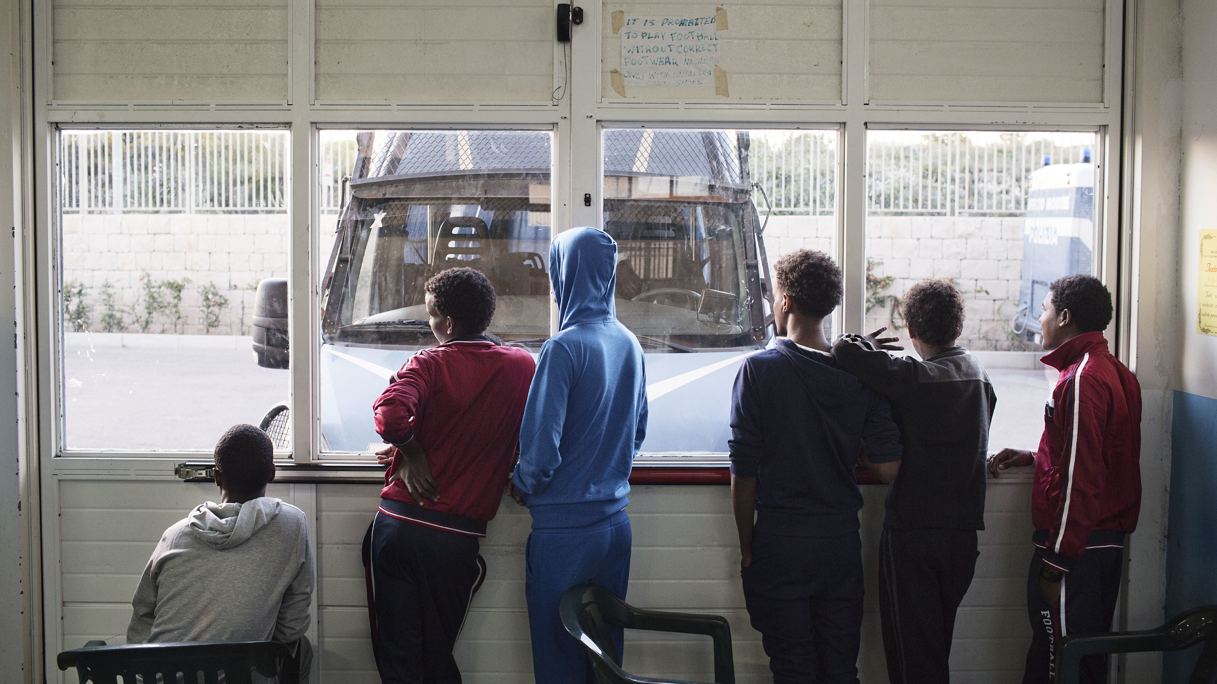 A group of young Eritreans at a migrant reception centre in Pozzallo, Italy