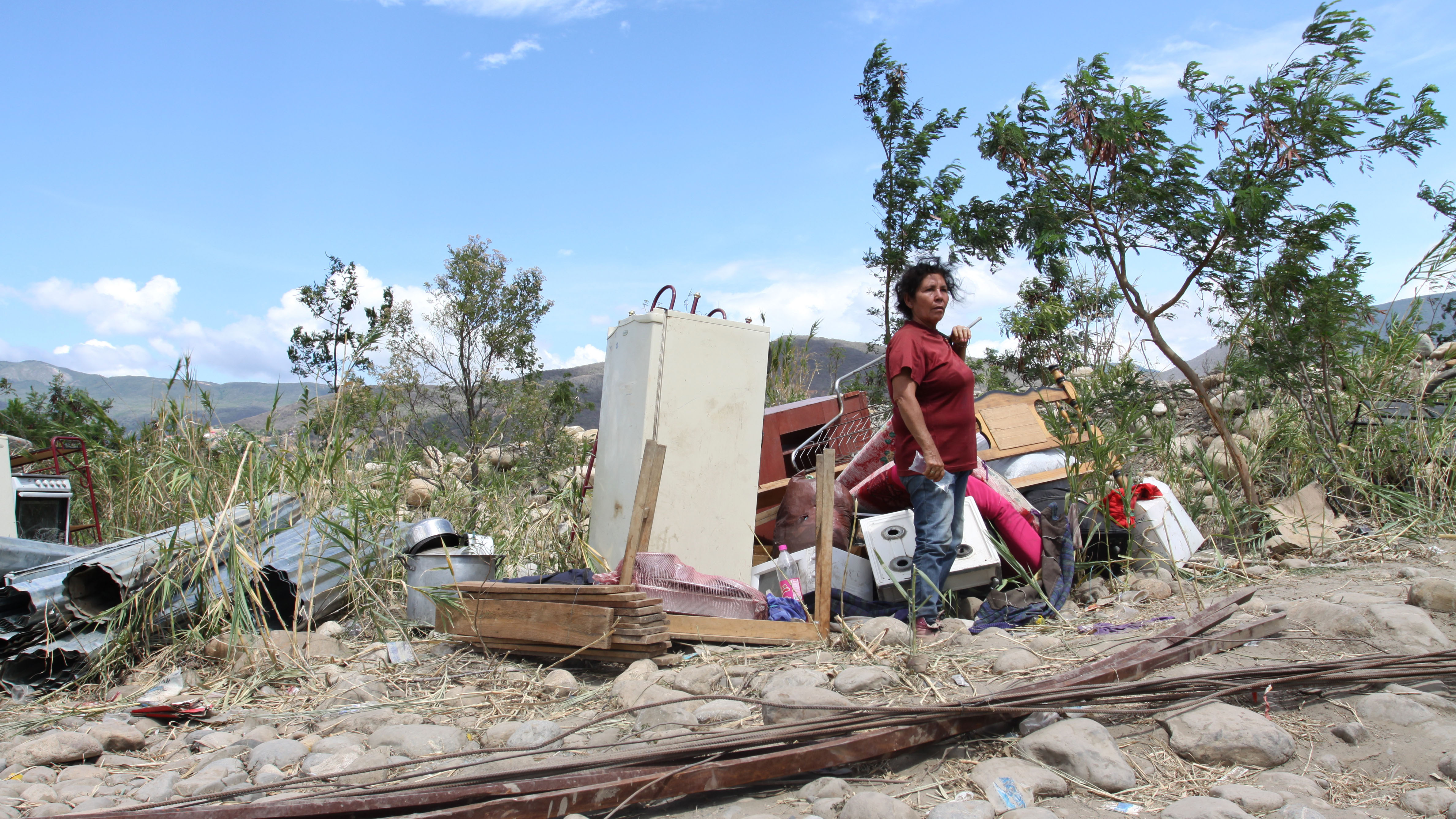 Blanca María Riobó crossed the Tachira River back into Colombia with her belongings, after authorities in Venezuela slated her home there for destruction.