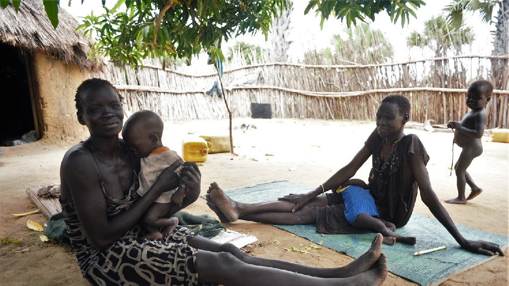 Elizabeth Nyawich with her children in Nyal, Unity State, South Sudan, to where thousands of civilians have fled conflict