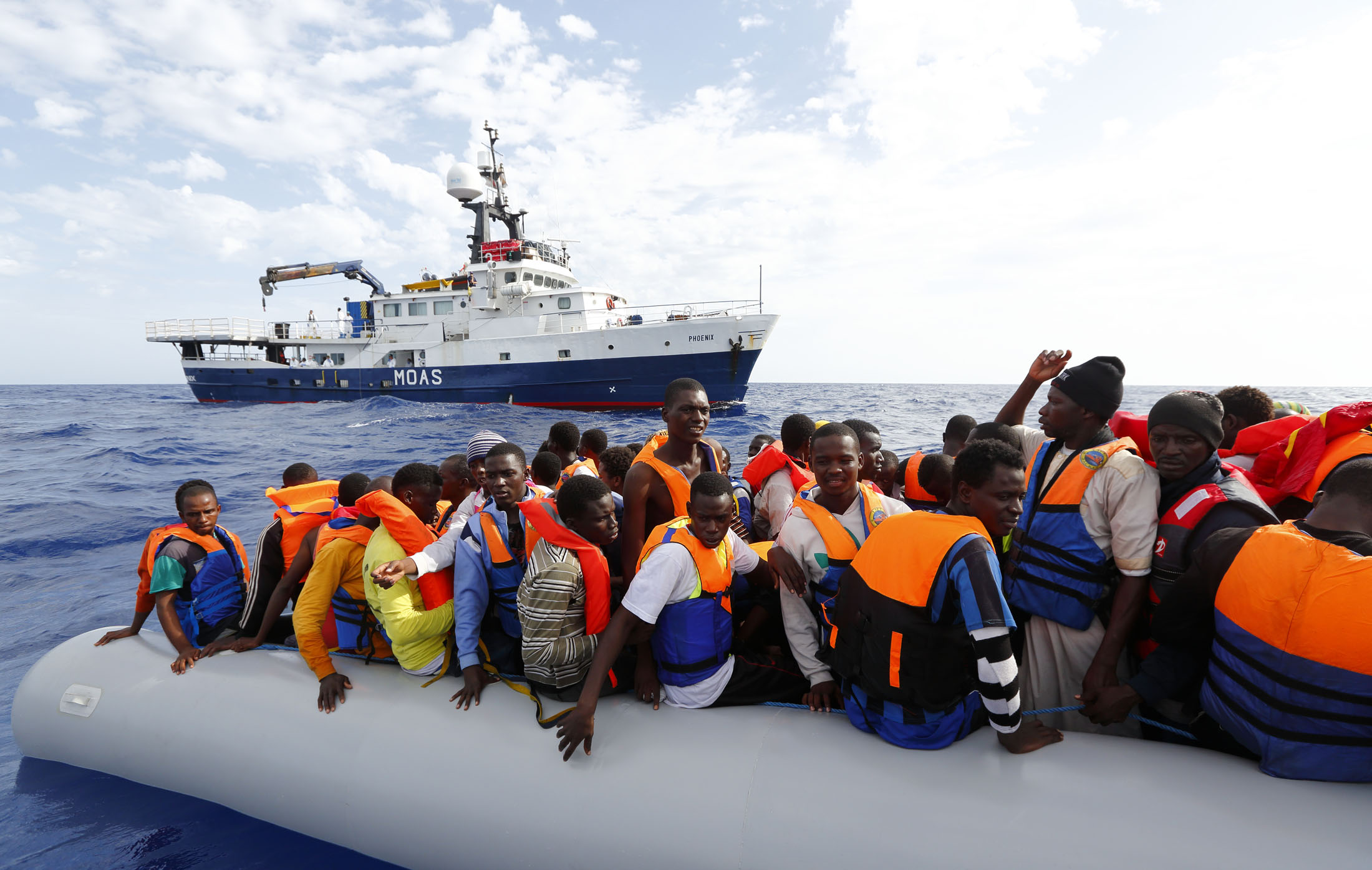 A ship run by the Migrant Offshore Aid Station rescues people attempting to enter Europe by boat on the Mediterranean Sea in 2014