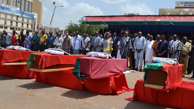 Authorities in Burkina Faso pay their respects to the 14 civilians who were killed by security forces during the days of violence following the 16 September coup.