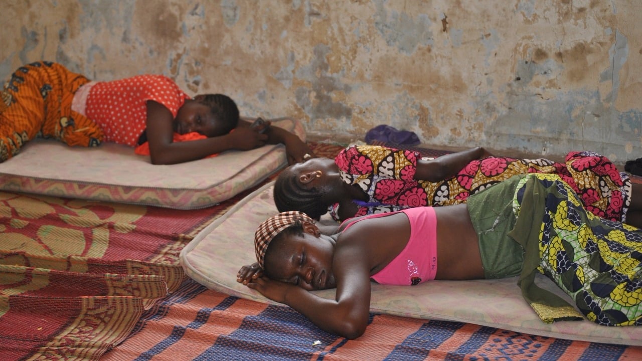 Displaced girls sleep in the floor in a rented house in Yola. IDPs share overcrowded houses and are often left to fend for themselves.