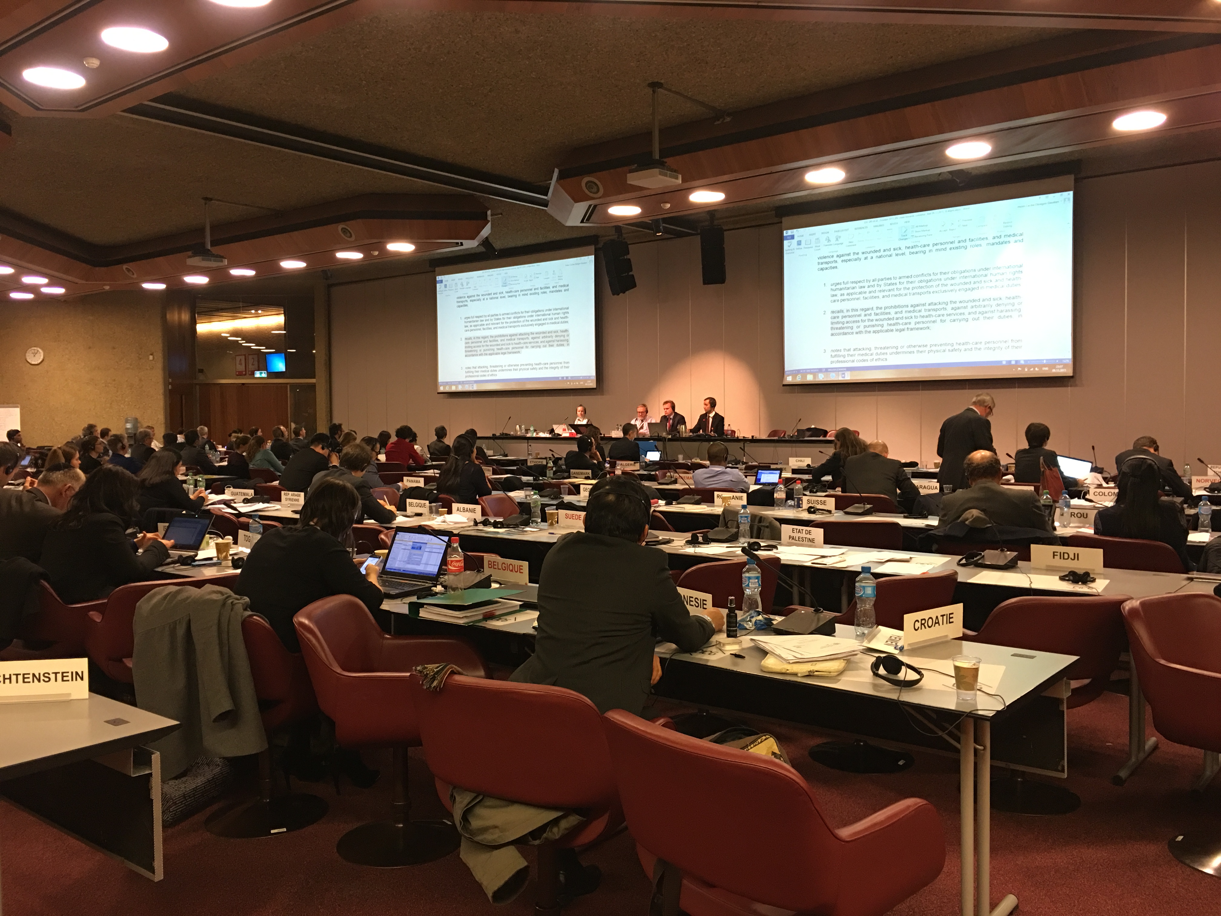 Past 11pm the day before a deadline for agreement, states party to the Geneva Convention negotiate a draft proposal to strengthen compliance with international humanitarian law at the 32nd International Conference of the Red Cross and Red Crescent in Gene