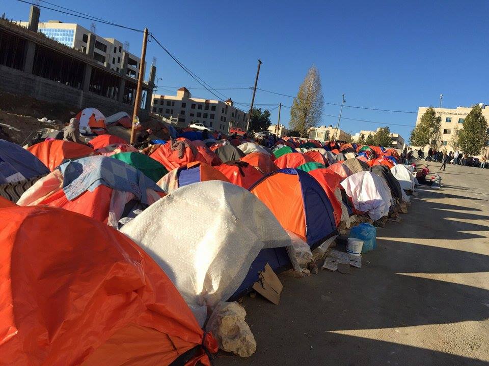Sudanese refugees and asylum seekers camped out outside the UNHCR offices in Amman in December 2015.
