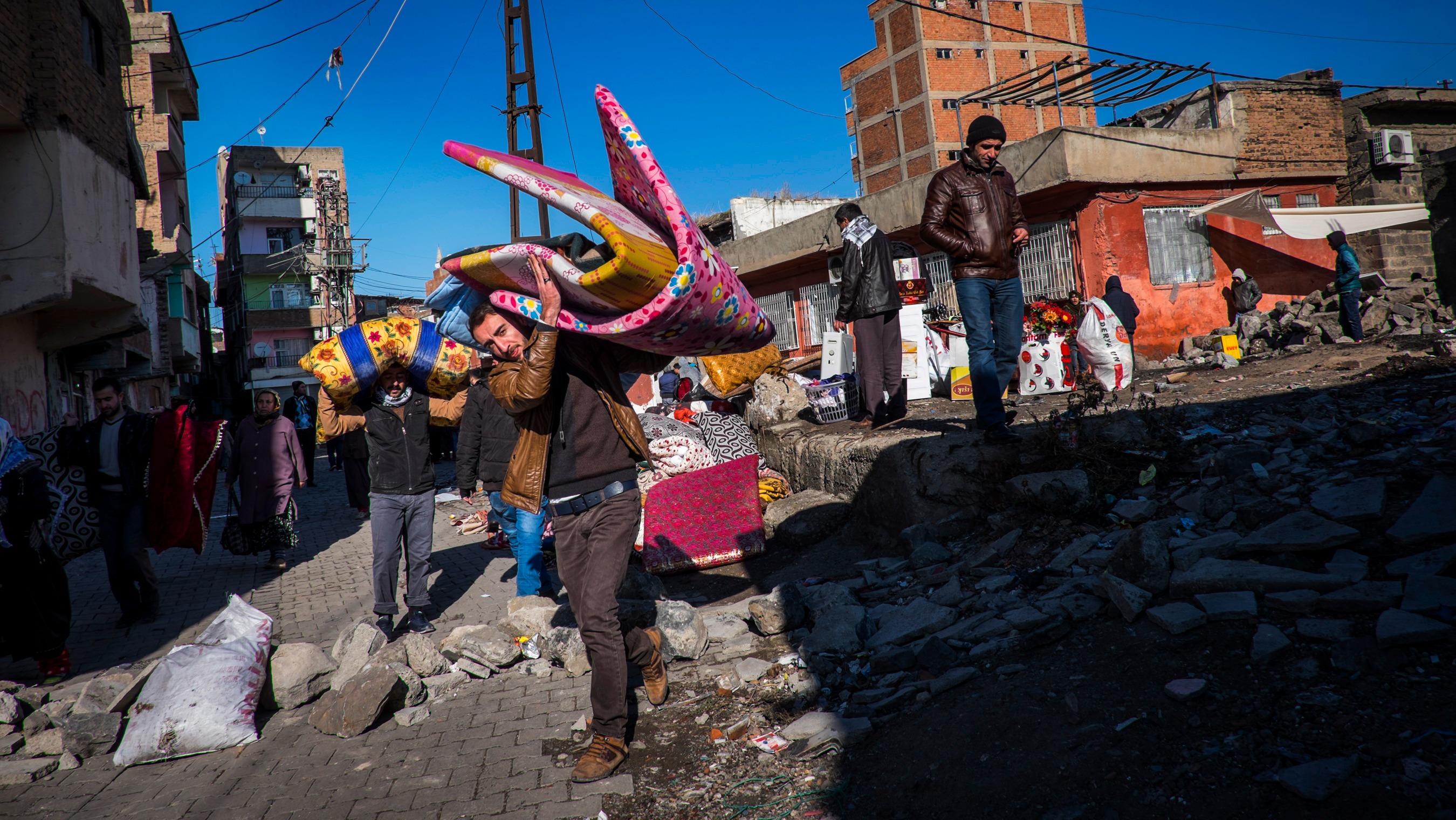 Residents of Sur in Diyarbakir flee an expanded curfew. Kurdish human rights organisations say fighting across southeastern Turkey has displaced 200,000 people in the last two months alone. Turkish authorities put the number at 93,000.