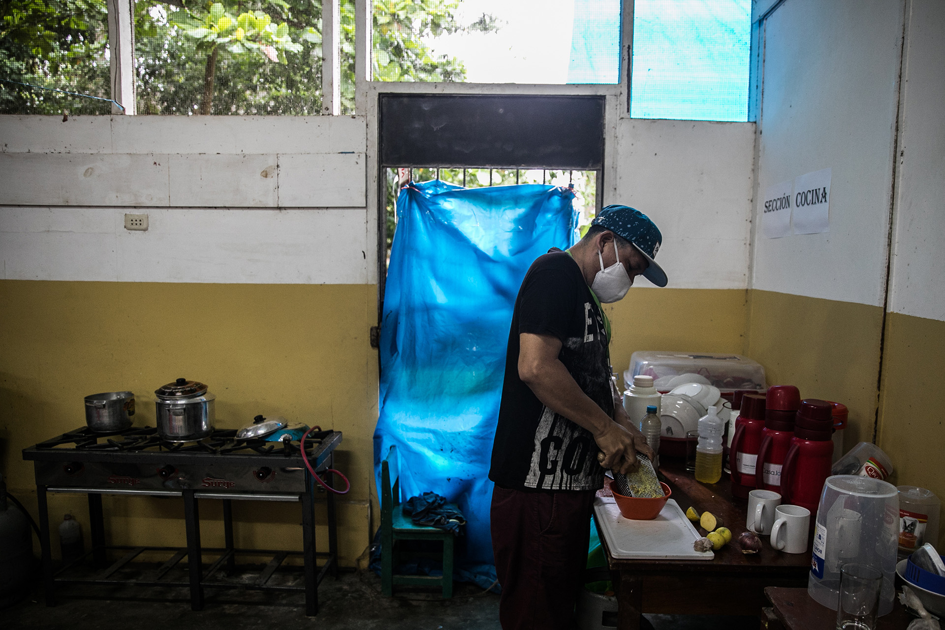 A volunteer preparing a natural treatment for COVID-19 patients in Yarinacocha