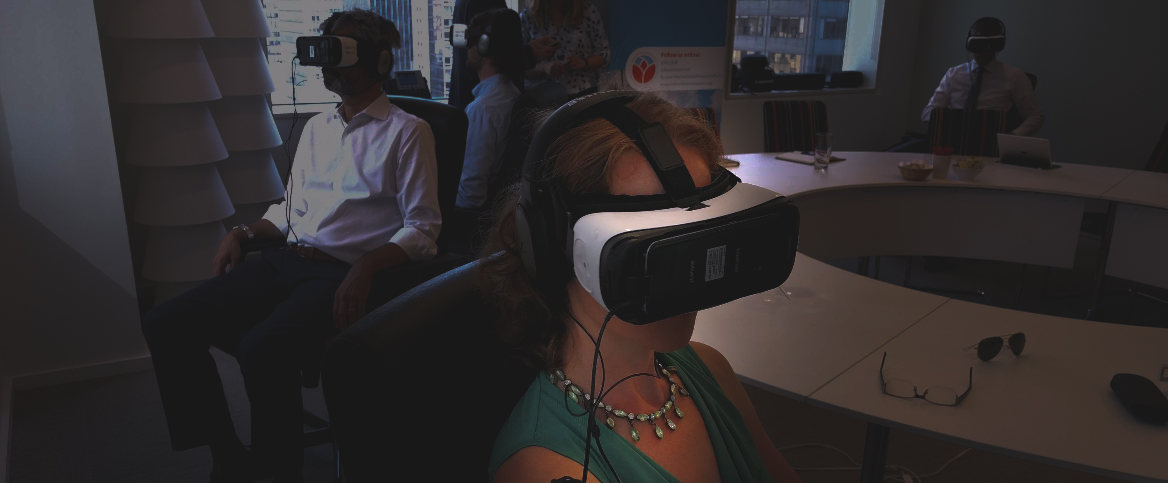 People watch a VR film using a headset