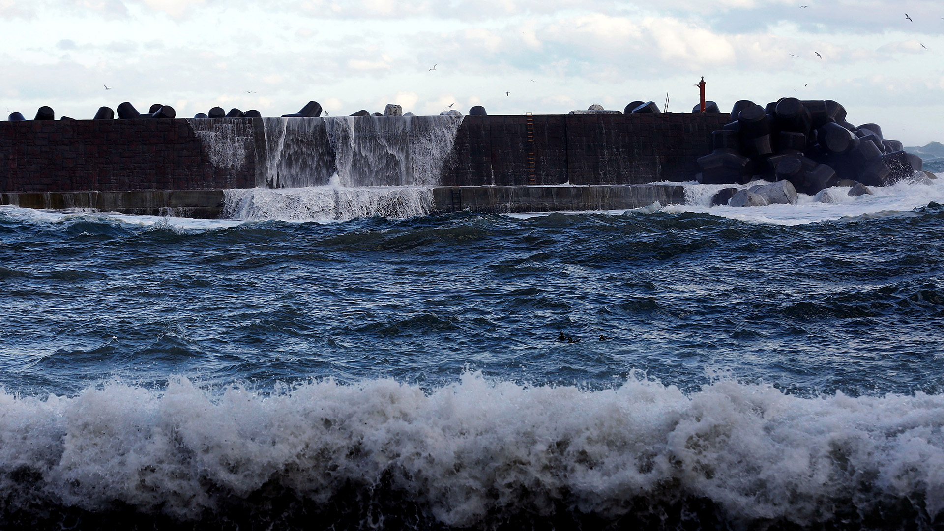 A high wave hits a seawall in Tanohata village, Iwate Prefecture, Japan one of the areas hit hardest by the 2011 earthquake and tsunami.