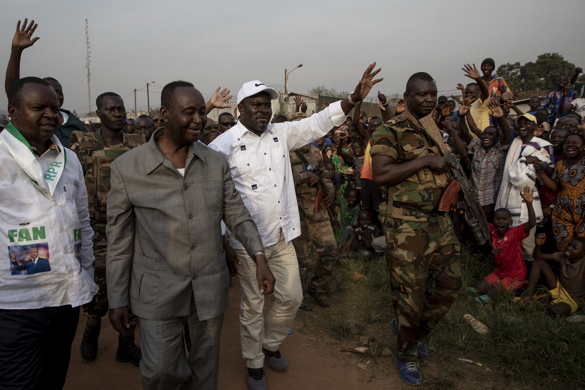 Members of the political opposition greet supporters ahead of this month’s presidential election, which takes place amid friction between rival candidates and ongoing clashes between rebel groups