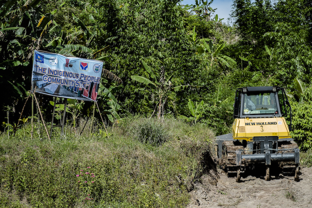 A bulldozer clears a road through indigenous ancestral land in the Philippines province of Compostela Valley in January 2016