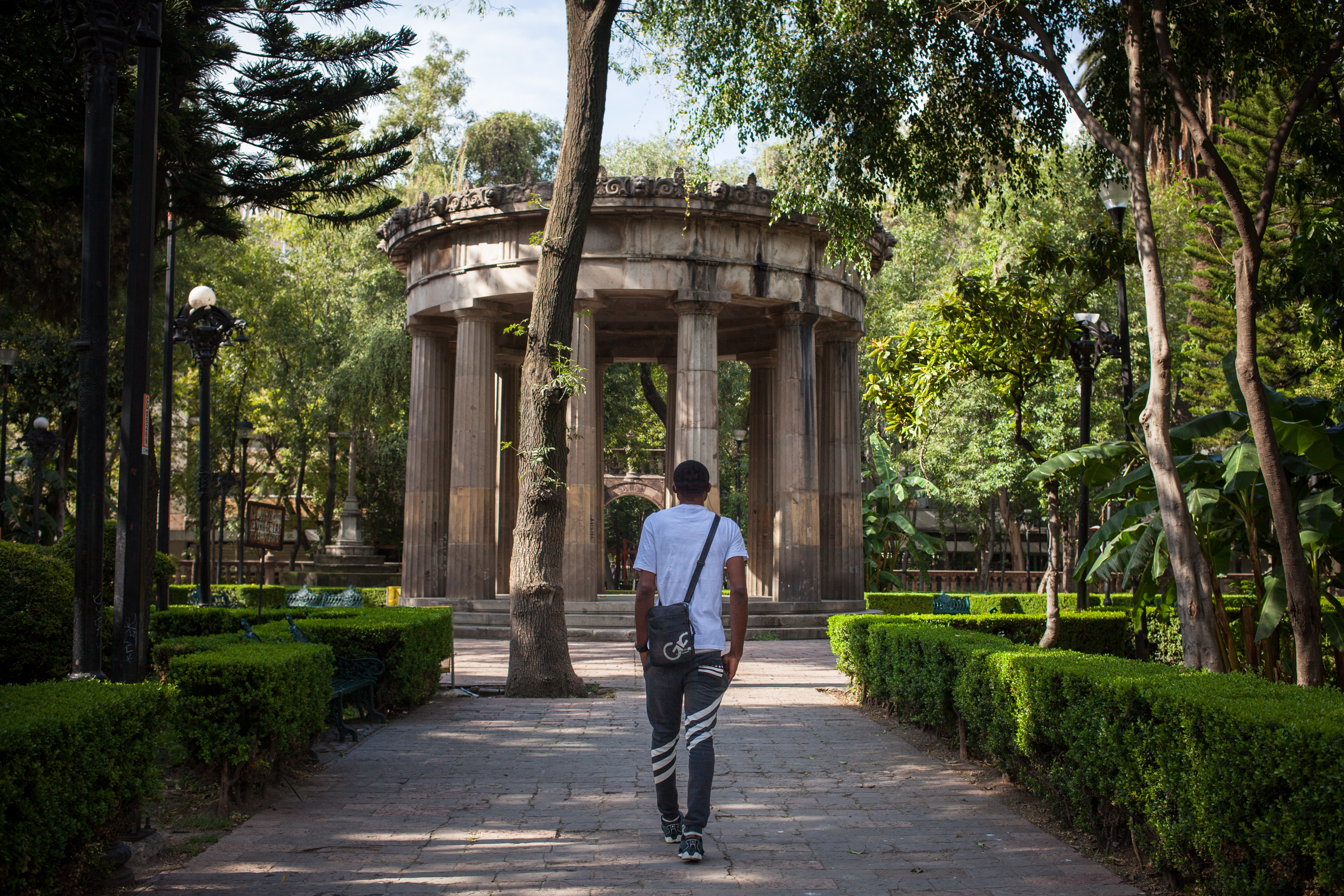 Victor walks through a park in Mexico City