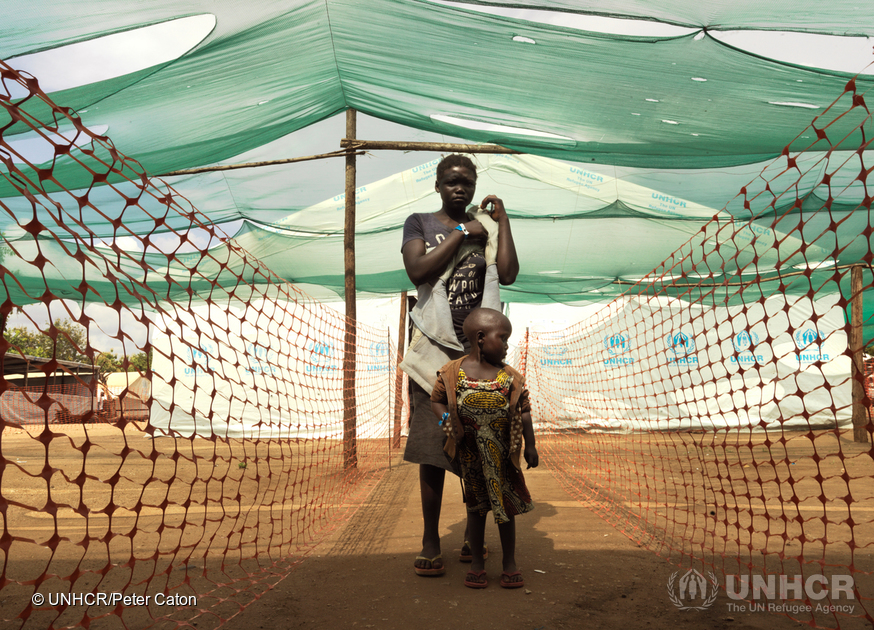 A South Sudanese mother and child arrive and wait to be registered at Imvepi settlement in northern Uganda.