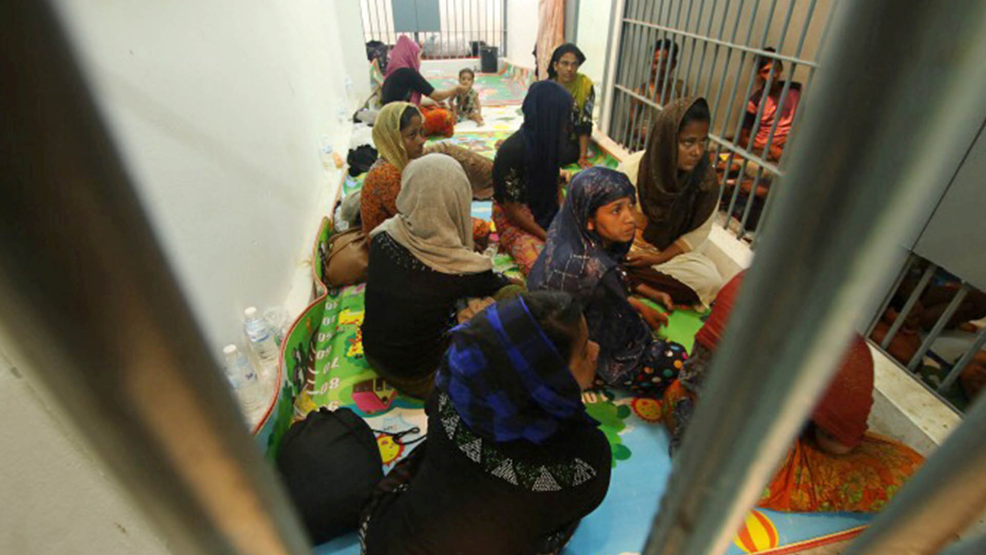 People are detained in a police station on 12 June 2019 after a fishing boat carrying more than 60 Rohingya refugees was found beached at Rawi Island in the province of Satun, Thailand, with borders Malaysia.