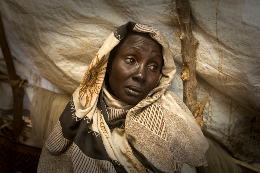 A woman cries at the news of the death of her son