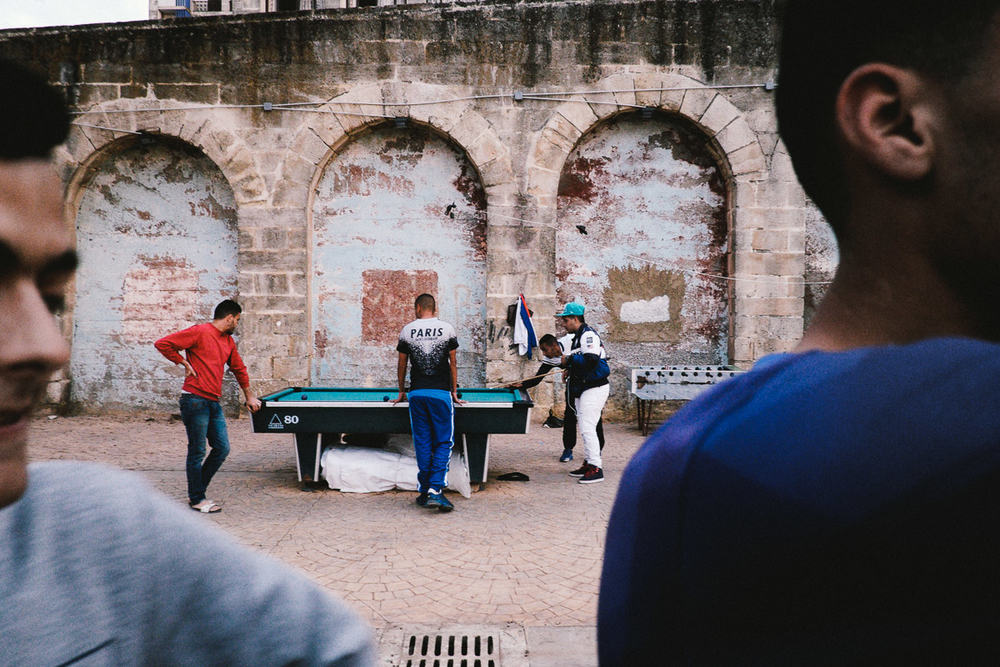 Young men play pool